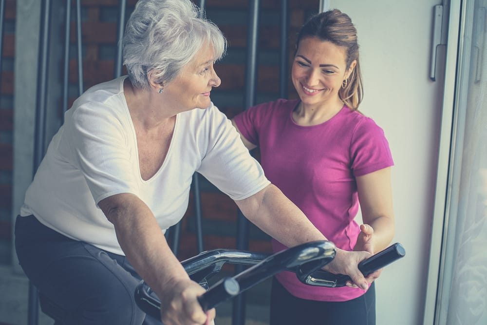 older female client with woman personal trainer