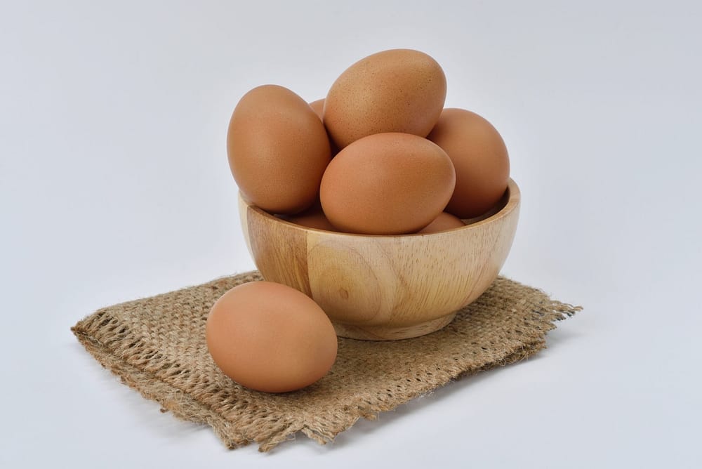 brown eggs in wooden ball