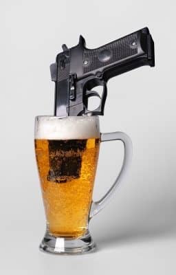 gun in a beer glass