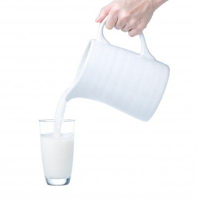 milk pitcher pouring into cup
